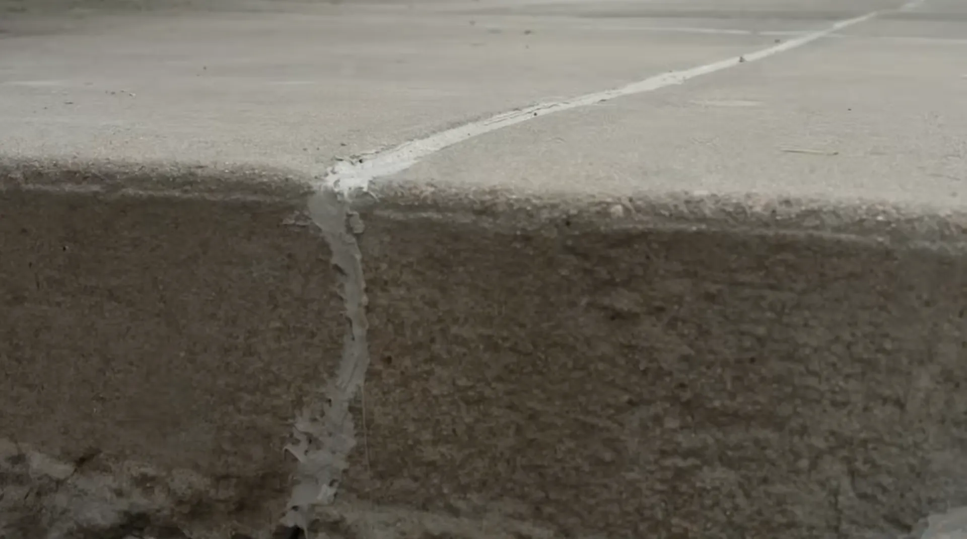 After concrete leveling - raised and flush slab with no settlement gap