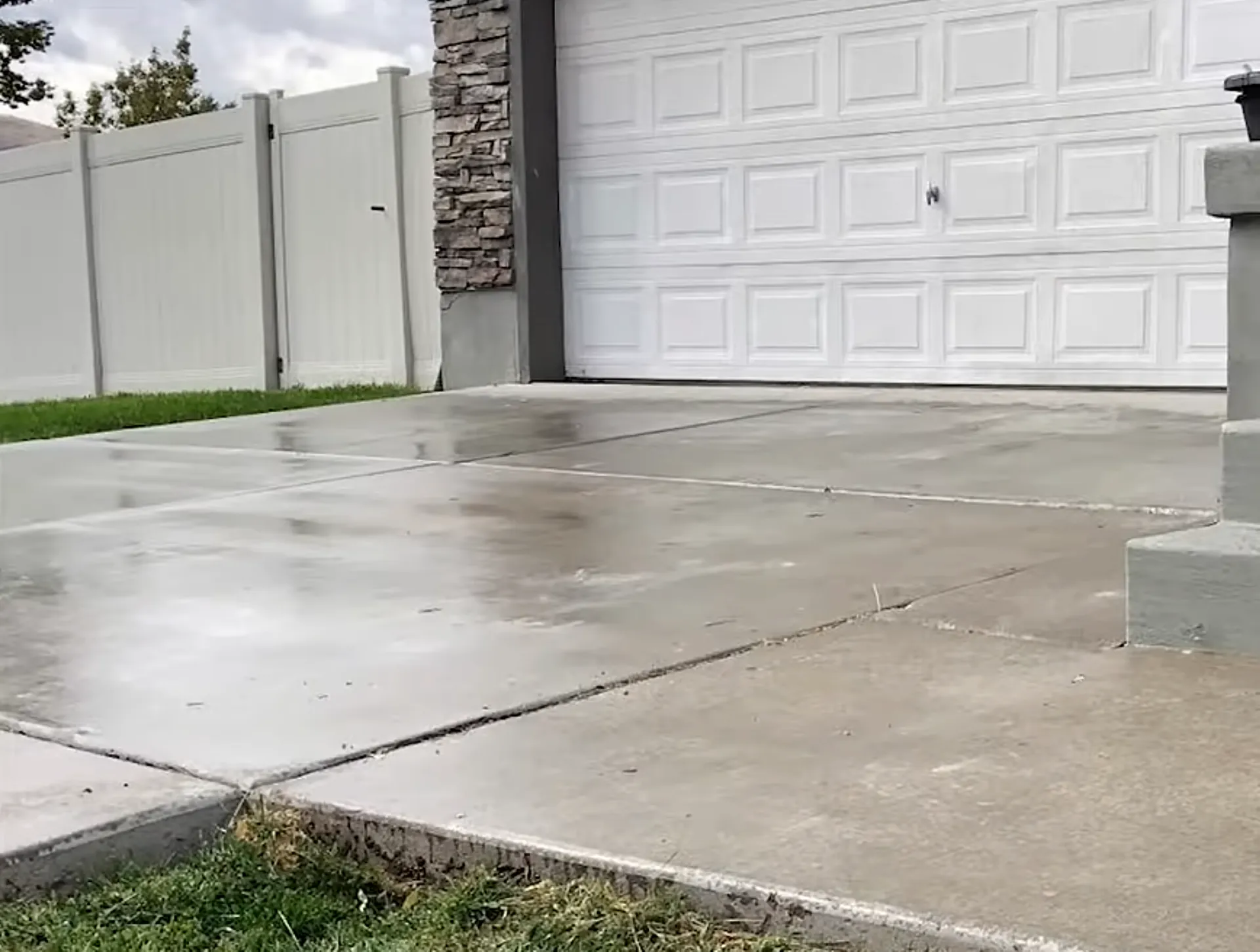 Concrete leveling crew inspecting and repairing a sunken residential slab