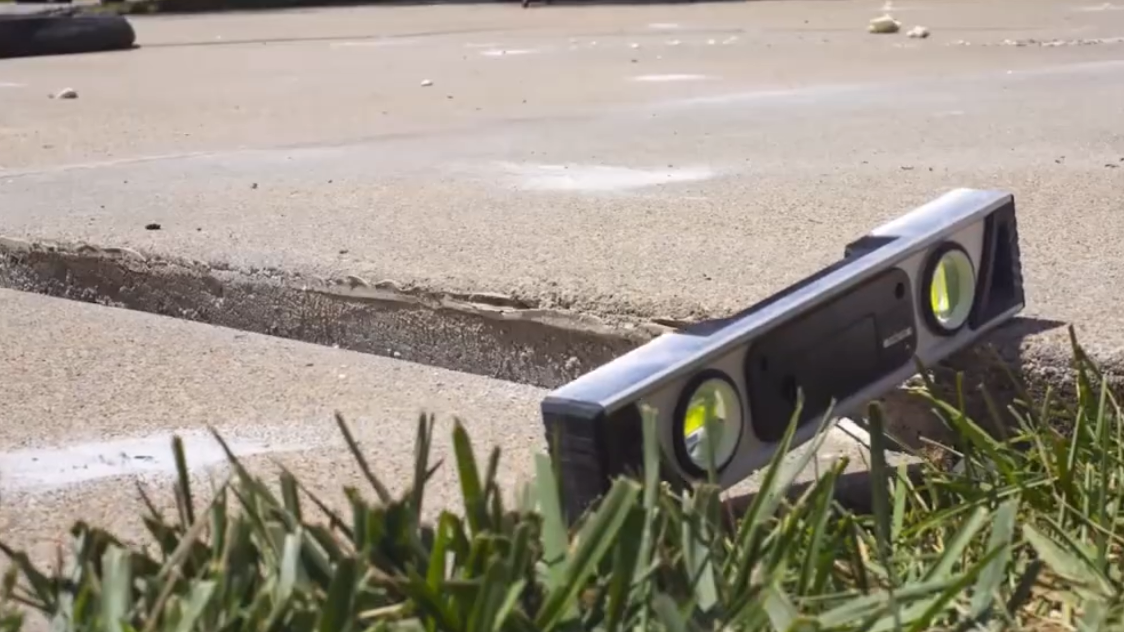 Sunken sidewalk section showing settlement and edge height difference