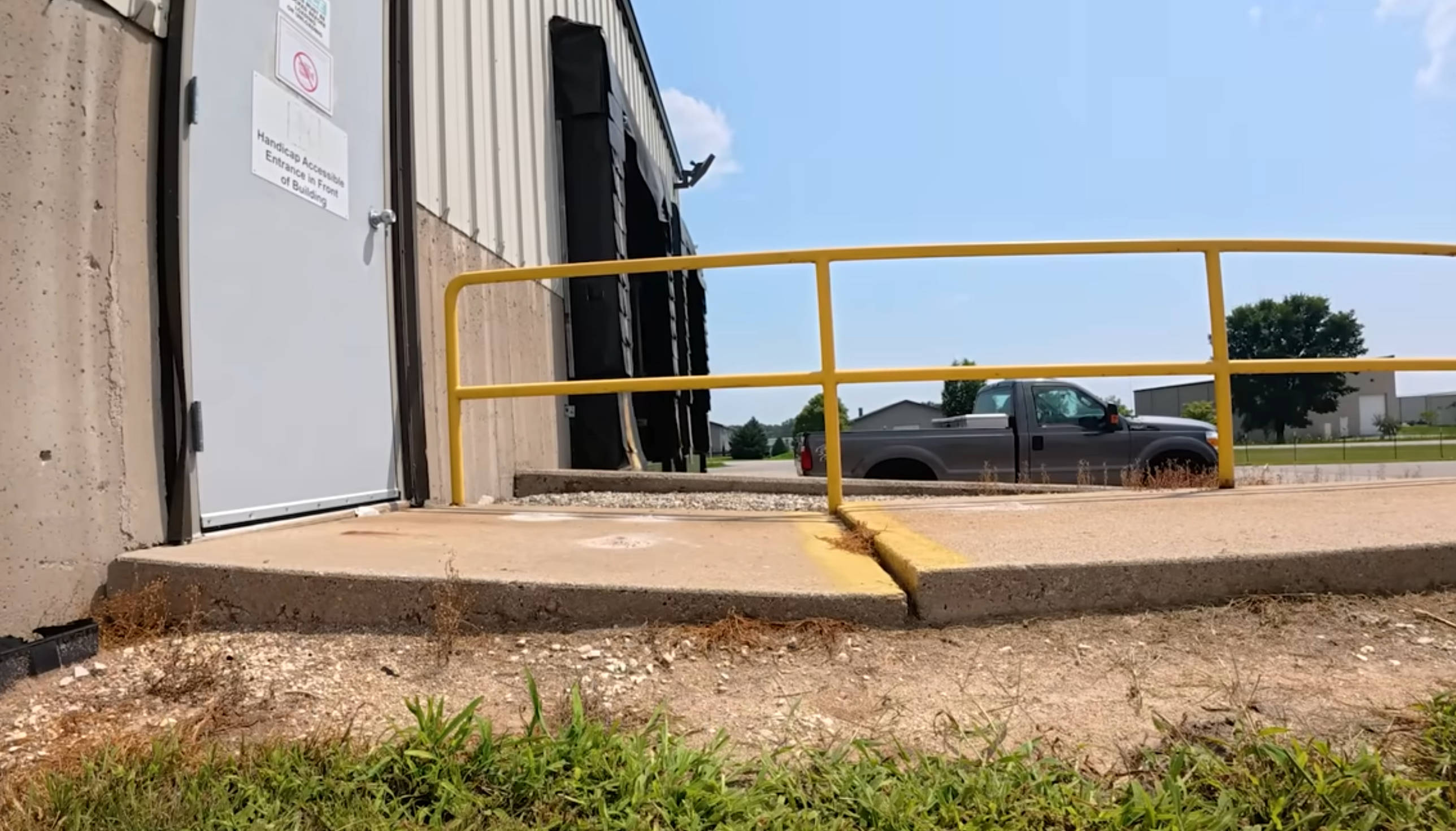 Uneven and sunken concrete slab showing visible settlement and a trip hazard